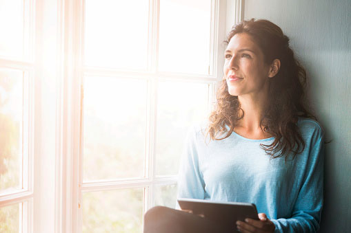 Woman thinking of questions for her dentist.