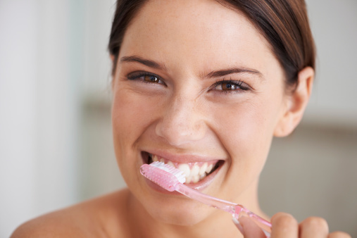 Woman brushing her teeth